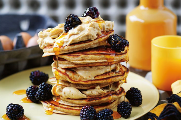Spiced peanut butter and honey pancakes with blackberries