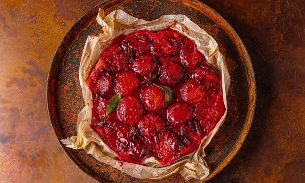Spiced plum tarte Tatin with bay, anise and sherry cream