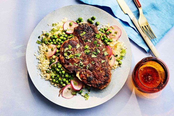 Spiced pork chops with buttery peas, radishes, and mint