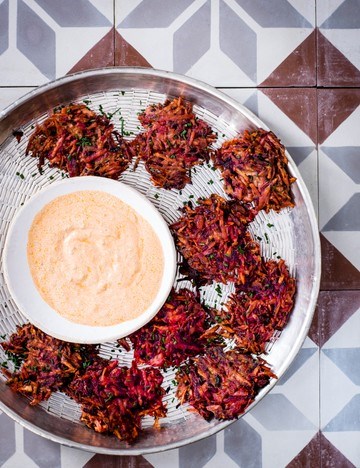 Spiced root vegetable fritters with harissa and lime yogurt