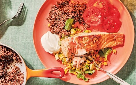 Spiced salmon fillets with toasted corn, avocado salsa, and sour cream