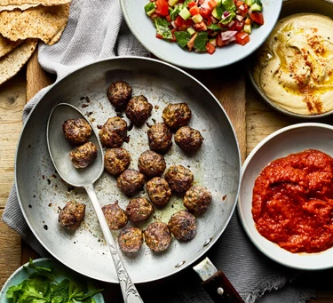 Spiced venison meatballs with flatbreads and chopped salad