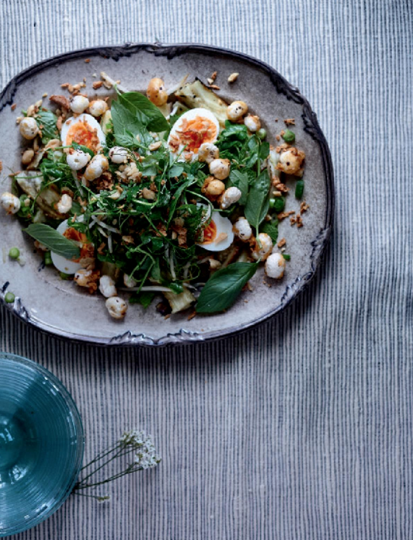 Spicy aubergine salad with peanuts, herbs, eggs and jaggery fox nuts