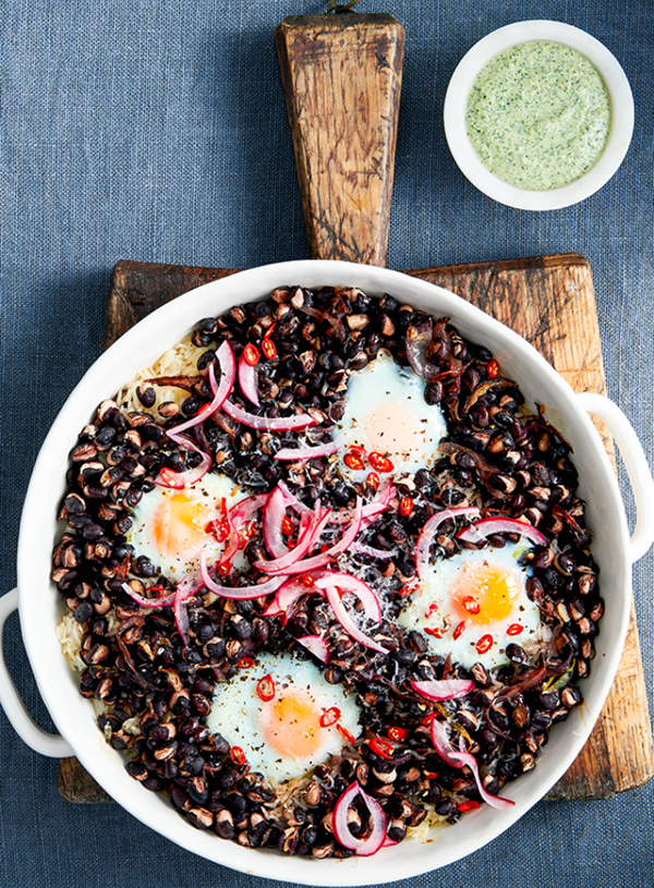 Spicy black bean baked eggs and rice with coriander salsa