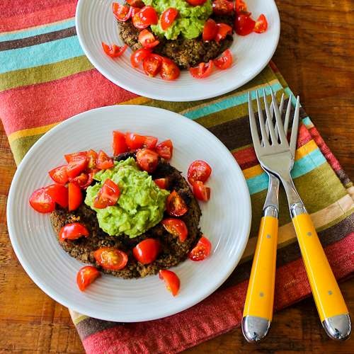 Spicy black bean patties with cilantro, guacamole, and tomatoes