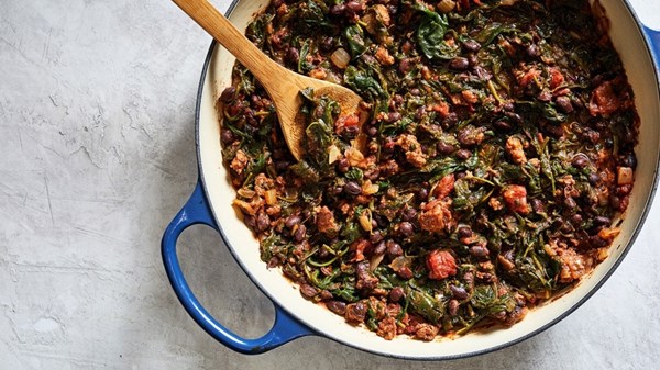 Spicy black beans with chorizo and greens
