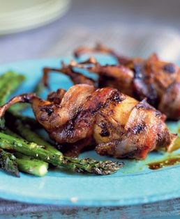 Spicy brown sugar quail stuffed with cheese grits and wrapped in bacon