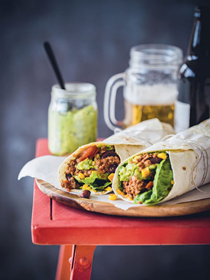 Spicy burritos with beef, avocado and beans