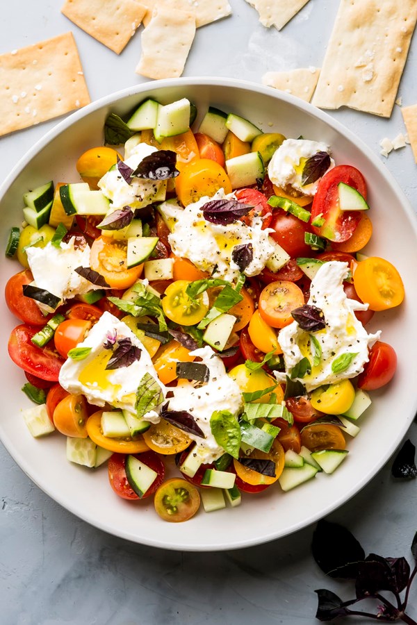 Spicy cherry tomato and cucumber salad with basil