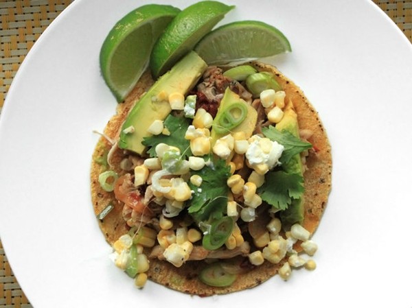 Spicy chicken tacos with corn, feta, and avocado