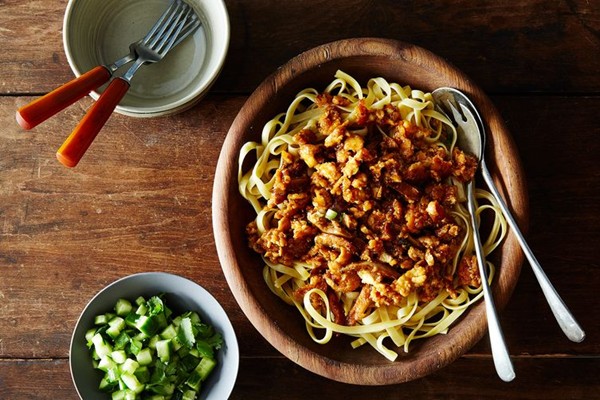 Spicy garlic noodles with crumbled tofu and cucumber salad 