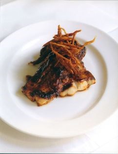 Spicy glazed huss with crispy shallots