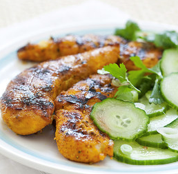 Spicy grilled chicken tenders with cucumber-coriander salad