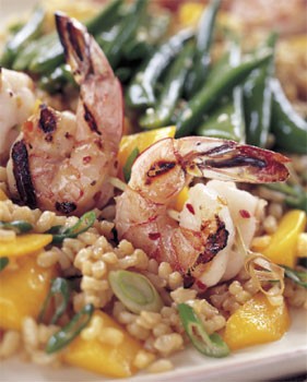 Spicy grilled shrimp with rice and mango salad and sesame sugar snap peas