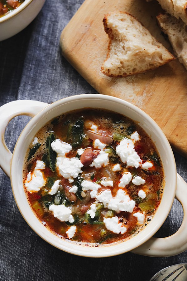 Spicy harissa bean stew with broccoli rabe