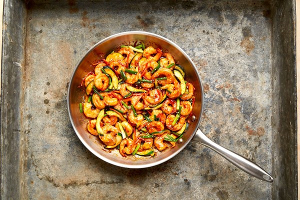 Spicy Korean-style shrimp with zucchini and scallions