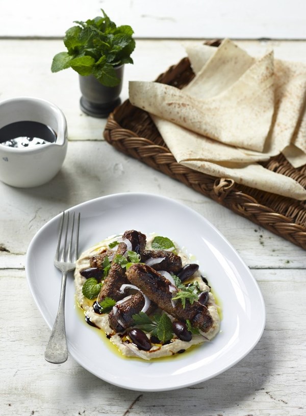Spicy lamb sausages with white bean hummus