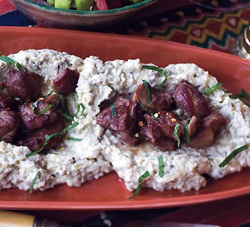 Spicy lamb with charred eggplant puree and pita