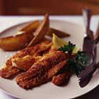 Spicy lemon sole with crisp potato wedges