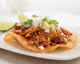 Spicy Mexican shredded pork toastadas (Tinga)