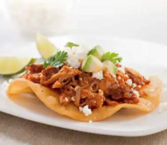 Spicy Mexican shredded pork tostadas with homemade chorizo