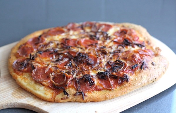 Spicy pepperoni pizza with caramelized onions