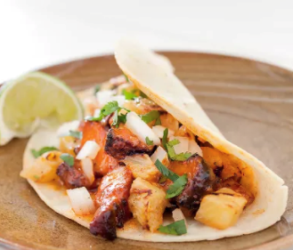 Spicy pork tacos (al pastor)