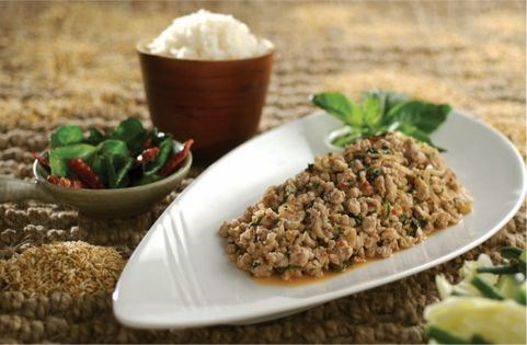 Spicy pork with roasted rice powder, crispy lime leaves and sticky rice (Laarb moo)