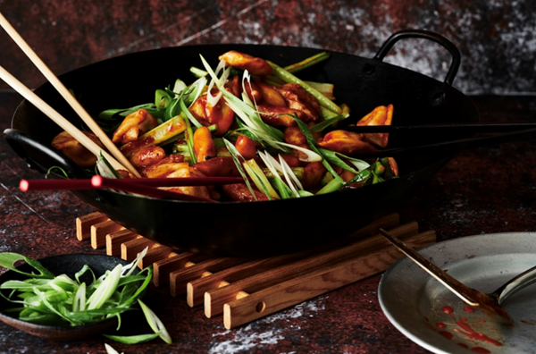 Spicy rice cake, dumpling and greens stir-fry