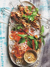Spicy satay chicken skewers with carrot and daikon salad