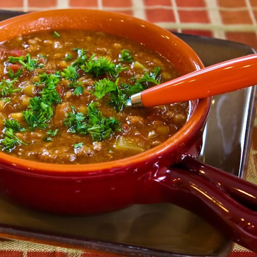 Spicy sausage, lentil, and tomato soup