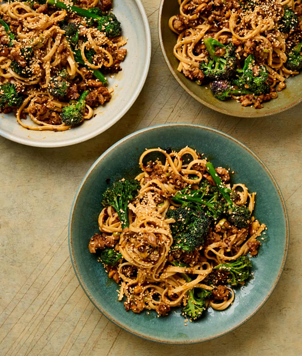 Spicy sesame purple sprouting broccoli and sausage noodles