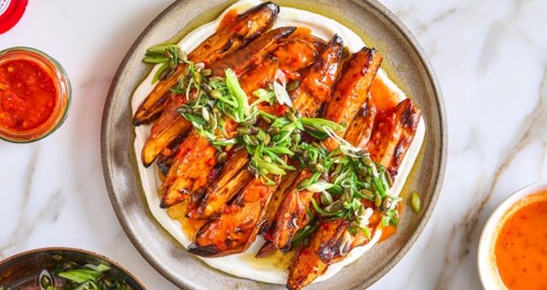 Spicy sweet potatoes with spring onion and pumpkin seed salsa