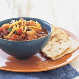 Spicy three-bean chili with warm corn tortillas