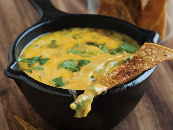 Spicy tortilla crisps with queso fundido