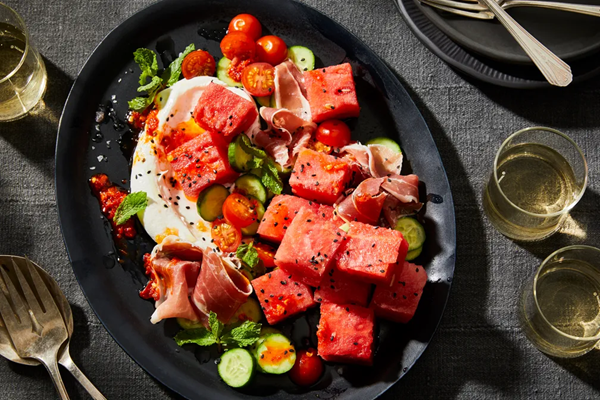 Spicy watermelon with tomatoes, prosciutto & salted-lime yogurt