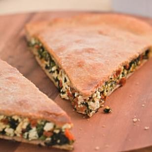 Spinach & sun-dried tomato stuffed pizza