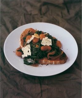 Spinach and butter bean stew on bruschetta with truffle oil