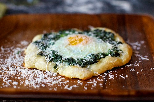 Spinach and egg pizzettes