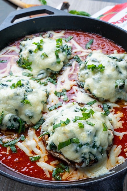 Spinach and ricotta stuffed portobello mushrooms in tomato sauce