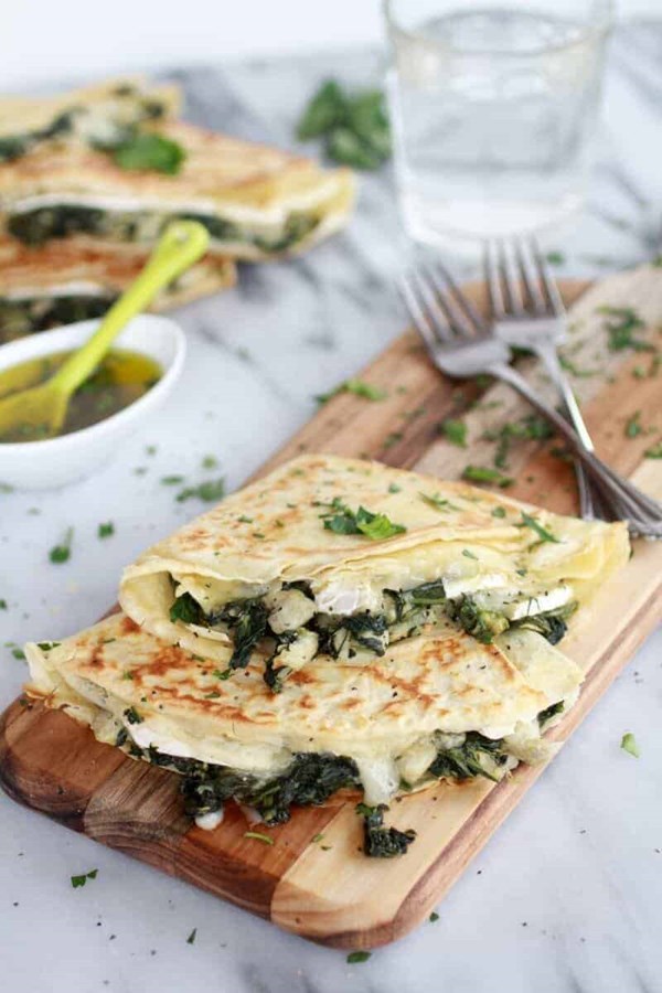 Spinach artichoke and Brie crepes with sweet honey sauce