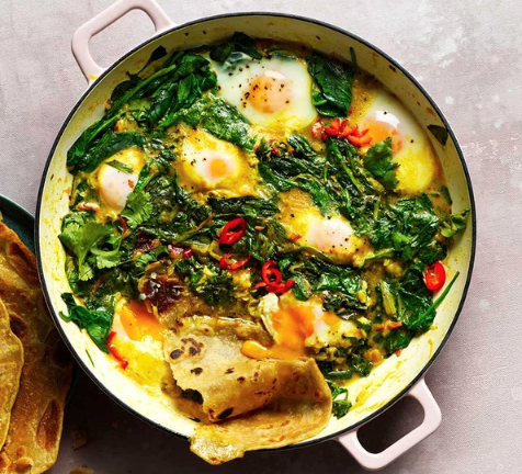 Spinach, coconut & turmeric baked eggs with paratha