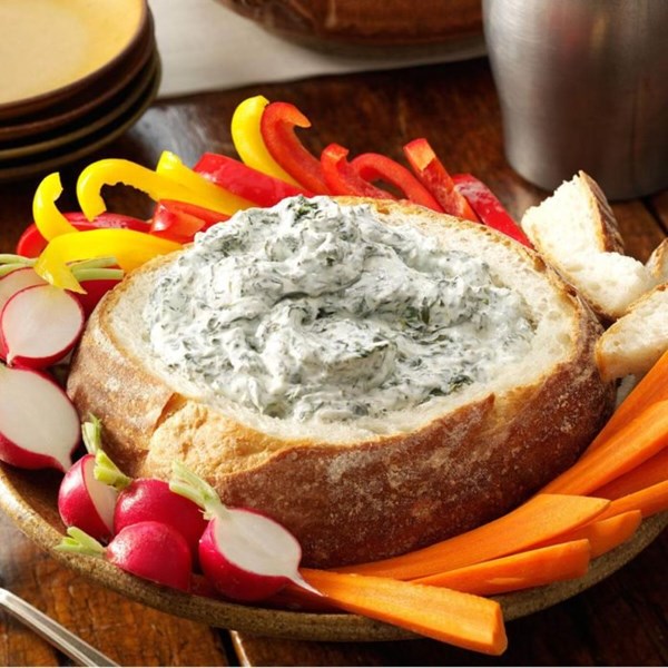 Spinach dip in a bread bowl