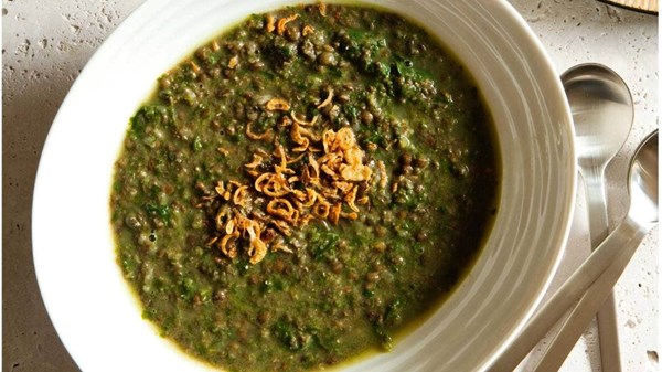 Spinach lentil soup with crisp onions and tahini pita