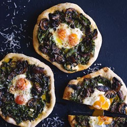 Spinach, mushroom and egg pizzas
