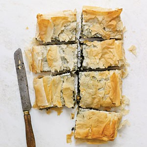Spinach pie with goat cheese, raisins, and pine nuts