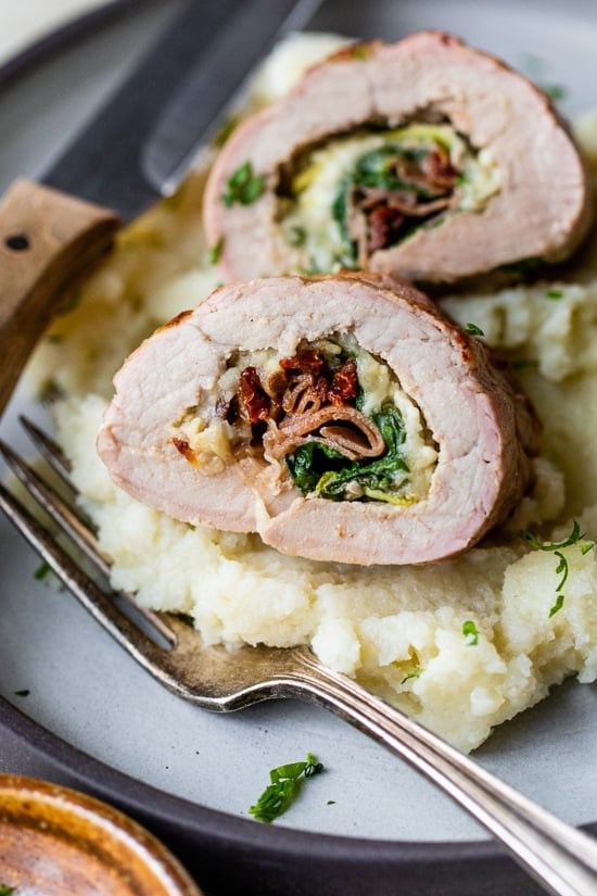 Spinach prosciutto and mozzarella stuffed pork tenderloin