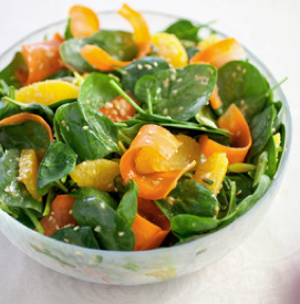 Spinach salad with carrot, orange, and sesame