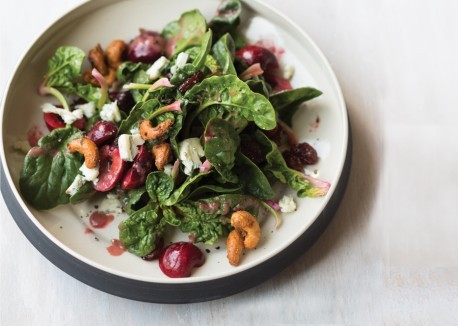 Spinach salad with cherries and candied cashews