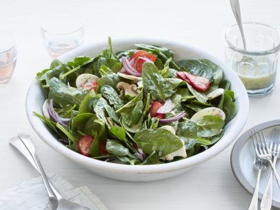 Spinach salad with pickled strawberries and poppyseed dressing